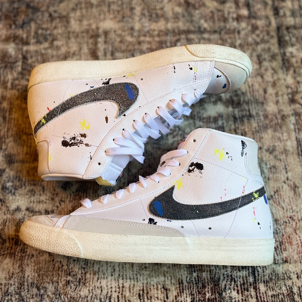 Nike White High-Top Sneakers with Black Swoosh and Paint Splatter